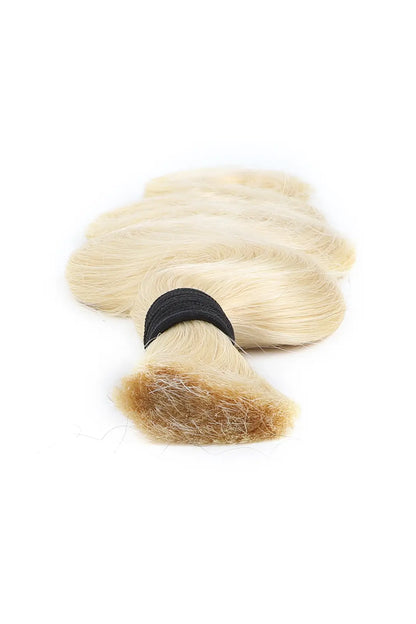 Detail of the ends of single drawn 613 blonde body wave bulk human hair for braiding